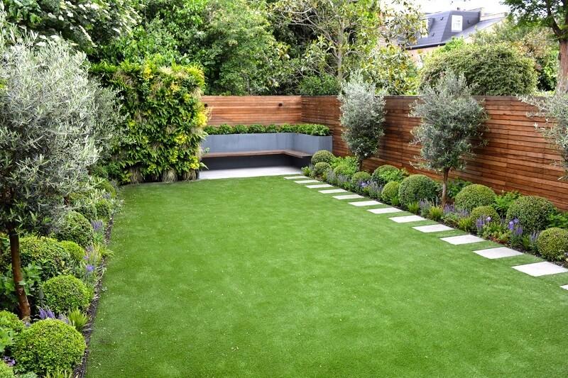 Beautifully manicured backyard with stepping stones